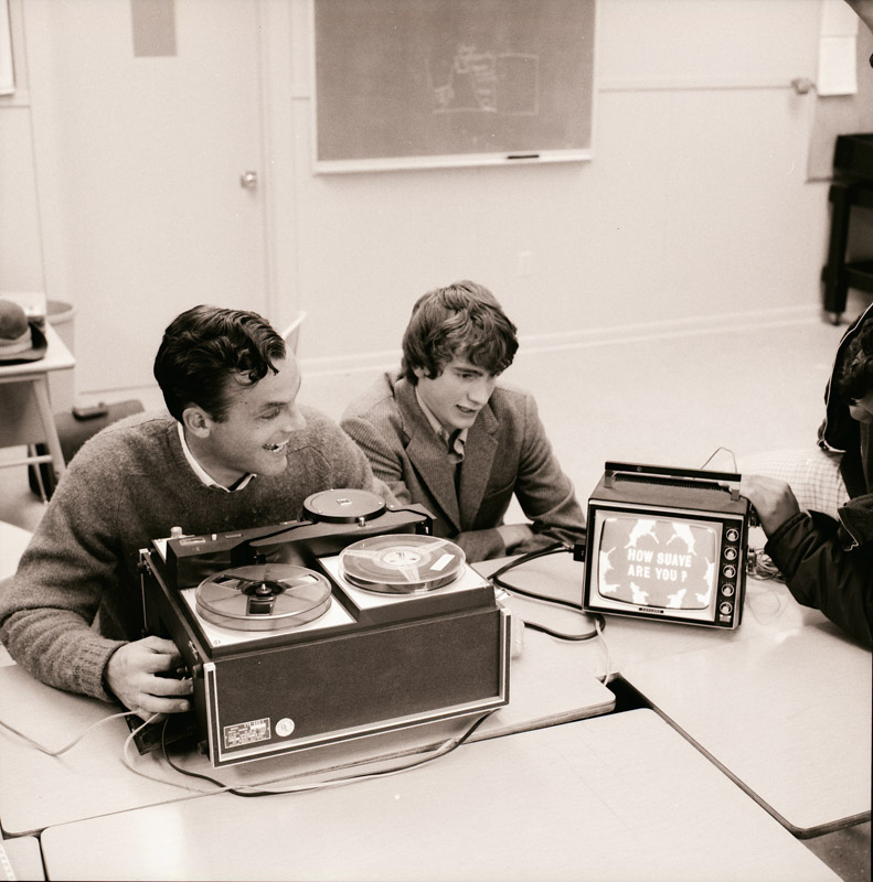 Faculty member Dean Soule(L) and ChristopherHerron '71 working with film during an early media class at Lakeside. The Concord video recorder in the photo was given to Lakeside in 1970 by Mrs. J. Elroy McCaw and her sons: Bruce '64, Craig '68, John '69, and Keith '72. Faculty member Dean Soule(L) and ChristopherHerron '71 working with film during an early media class at Lakeside. The Concord video recorder in the photo was given to Lakeside in 1970 by Mrs. J. Elroy McCaw and her sons: Bruce '64, Craig '68, John '69, and Keith '72.